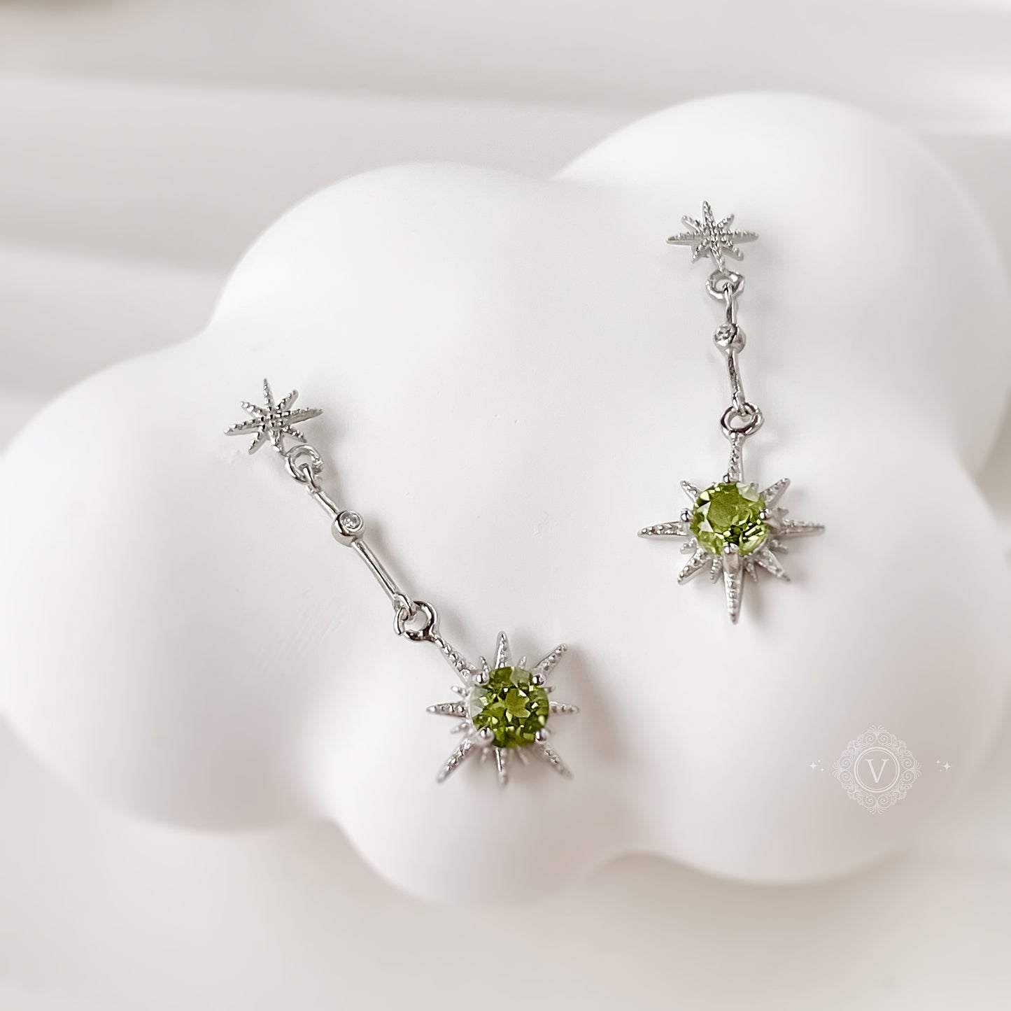 Sterling Silver Star-Shaped Peridot Earrings.