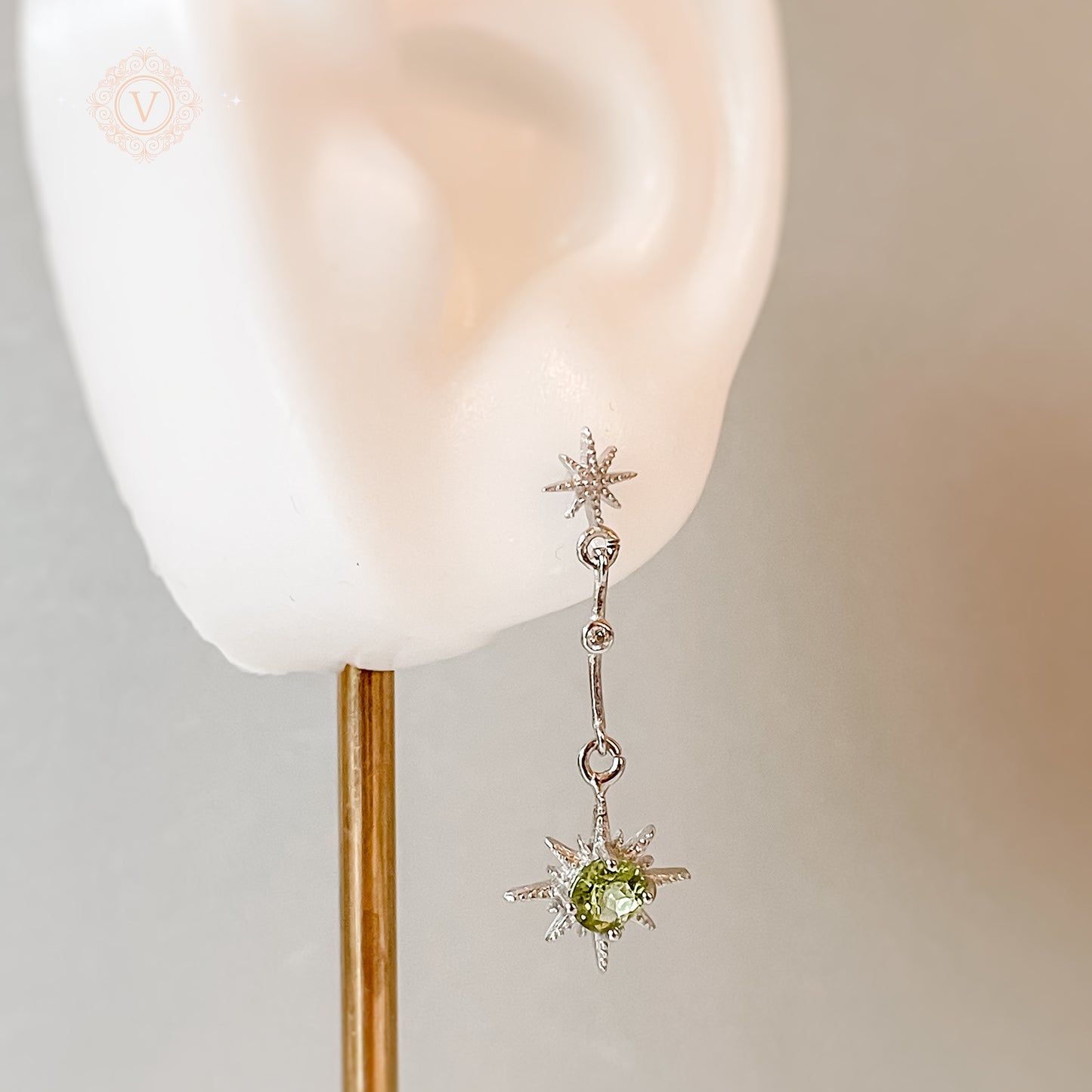 Sterling Silver Star-Shaped Peridot Earrings.