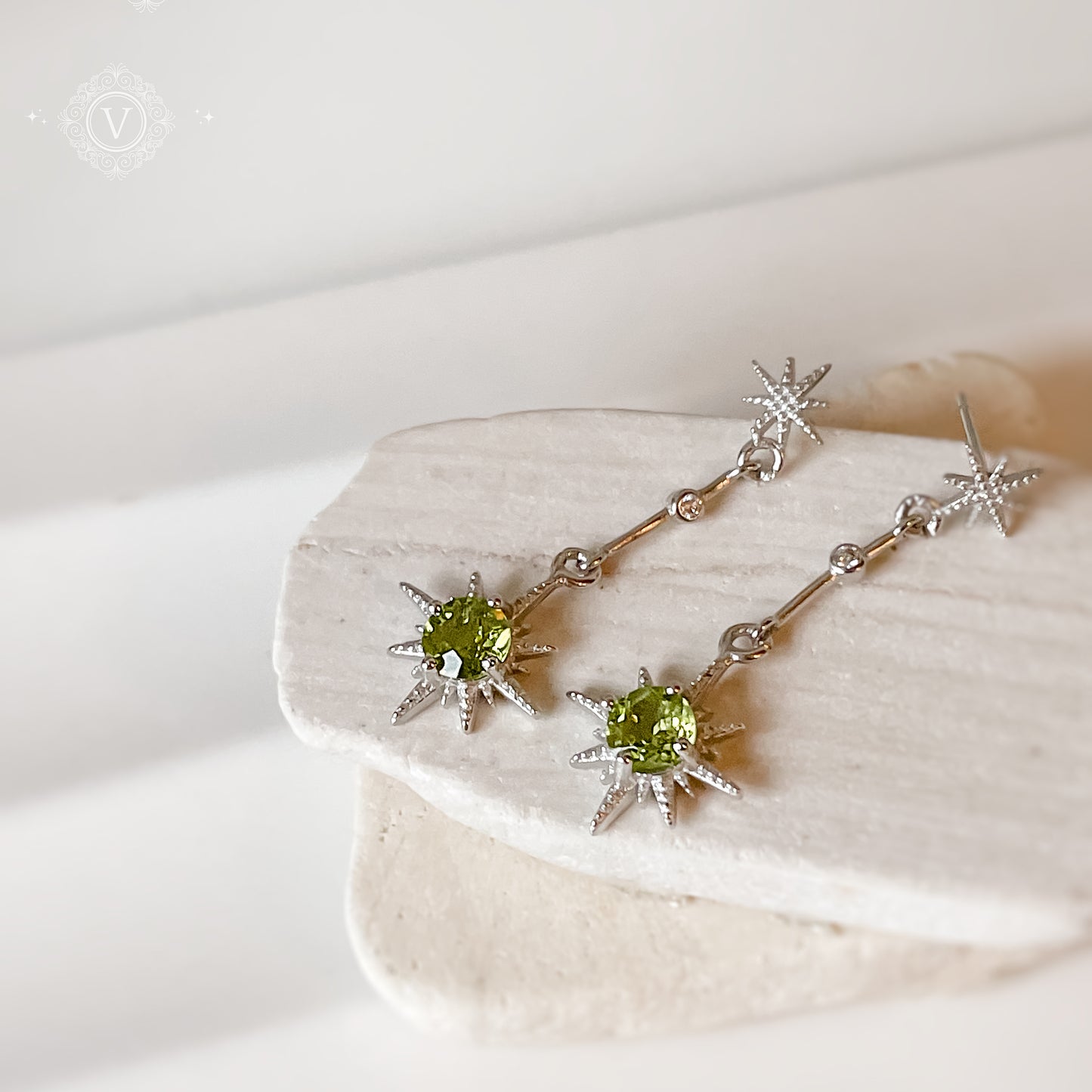 Sterling Silver Star-Shaped Peridot Earrings.