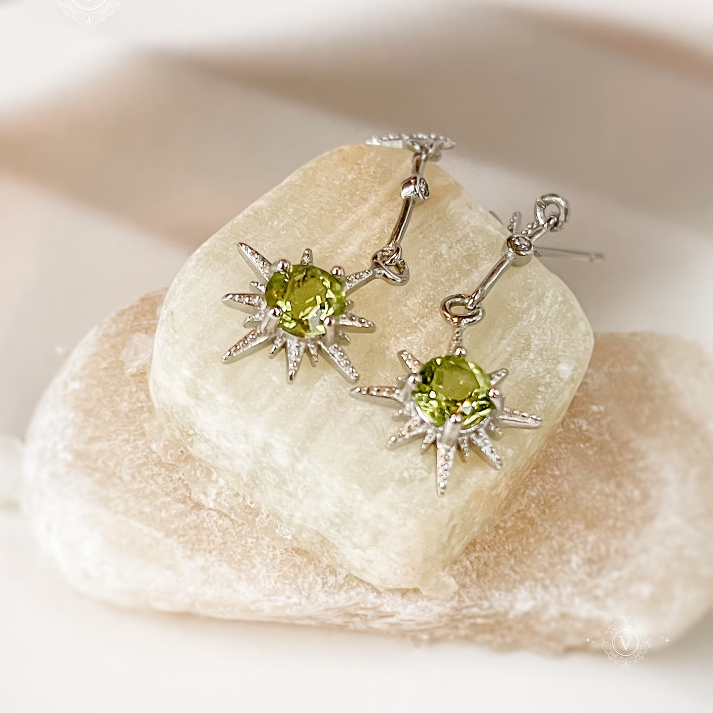 Sterling Silver Star-Shaped Peridot Earrings.