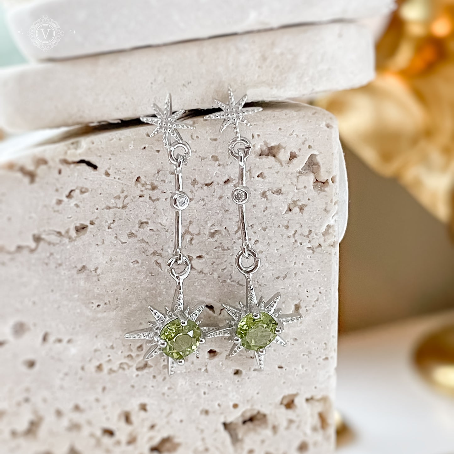 Sterling Silver Star-Shaped Peridot Earrings.